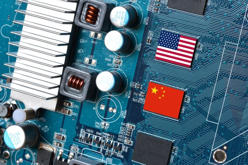 Flag of the Republic of China and the United States on microchips of a printed electronic board.