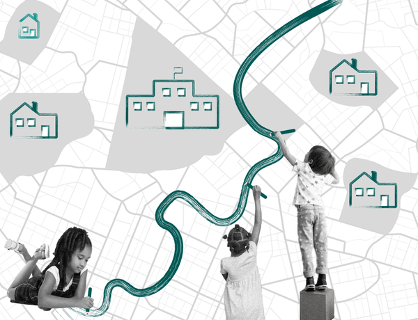 Three students paint a green line dividing houses and a school.